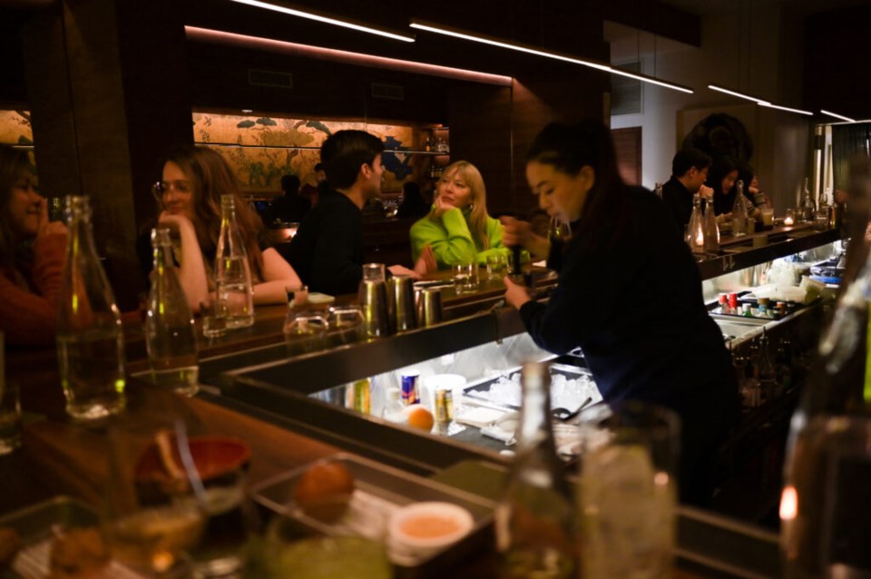 Customers sit at the bar at Niban. Photo: Jonathan Mora for the BK Reader.