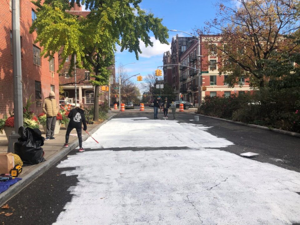 Gates Avenue got a coat of primer before starting the mural which will outline where the plaza will be. Photo: Miranda Levingston for the BK Reader.