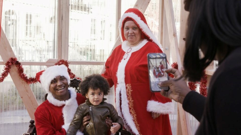 Bed-Stuy Council Member Chi Osse and Executive Director of the Bed-Stuy Gateway BID Dale Charles took up residency at Winter Wonderland Santa Hollow as Mr. and Mrs. Claus. Photo: Provided/ Bed-Stuy Gateway BID. 