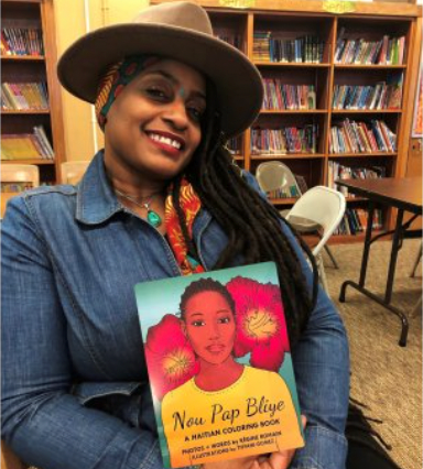 Regine Romaine holds a copy of "Nou Pap Bliye"