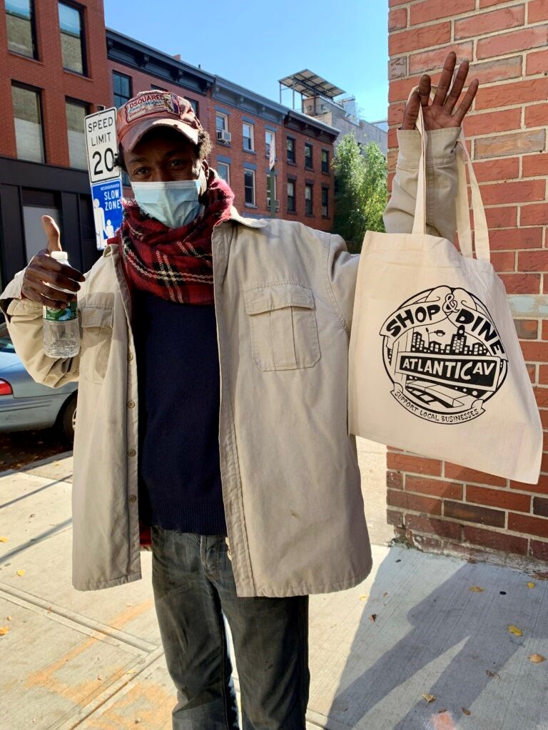 Check out the reusable tote bags full of local goodies and a map of all the best windows. Photo: Provided/ Atlantic Avenue Local Development Corporation.