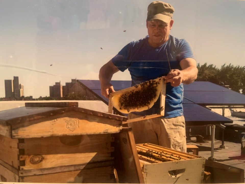 Tom Gordon handling his bees on his roof in Brooklyn. Photo: Provided/Tom Gordon.