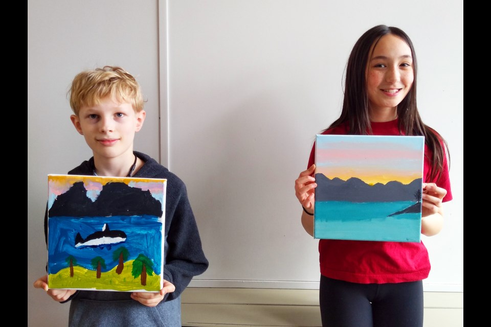 Sven and Sophia show off their entries in the ‘Elements of Bowen’ art exhibit.