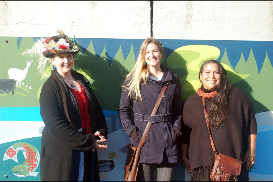 Artists Sarah Haxby, Di, and Paula Love with their creation. 