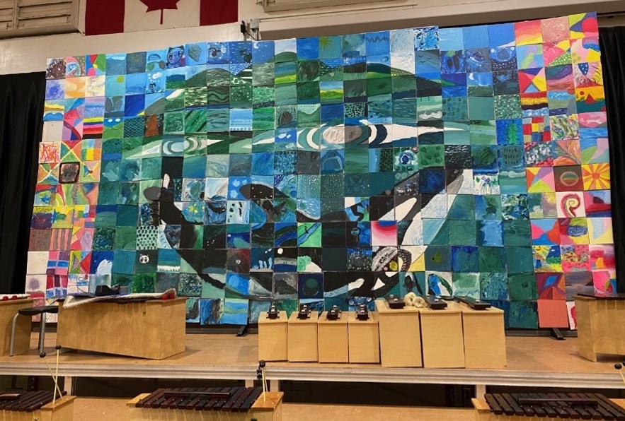 BICS students created the whale mural out of 300 tiles. 