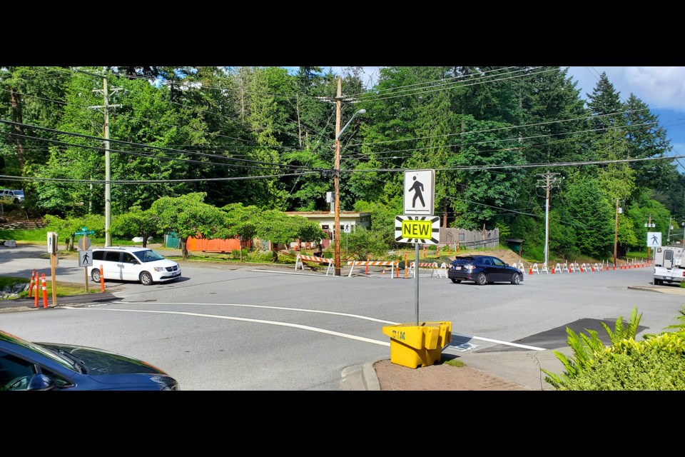 There's a new crosswalk for pedestrians to use on the west side of the four corners intersection.