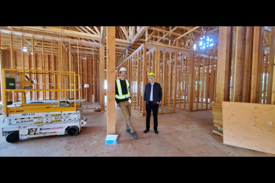 Dan Parke, architect with Salal Architecture (left) and Tim Rhodes, BIHCF president, tour the Community Health Centre in late September.
