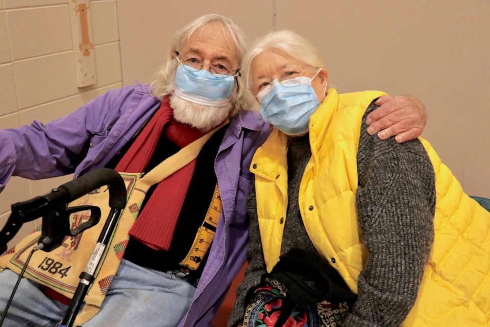 Ron and Heather Woodall wearing masks