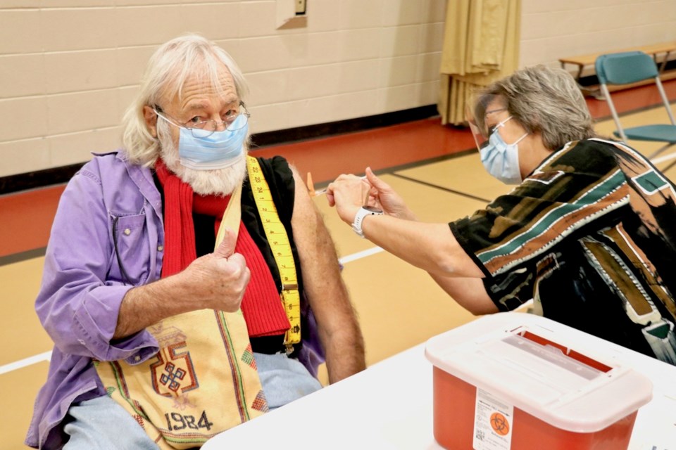 Ron giving thumbs up as he gets his vaccine