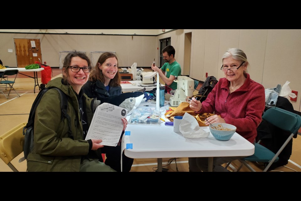 (L-R) Carmen McKay and Kelly Woods were on the Heritage Hunt, and found plenty of assistance from Janet Ross at her sewing station. 