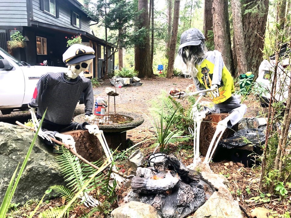 Fake Halloween skeletons around a campfire