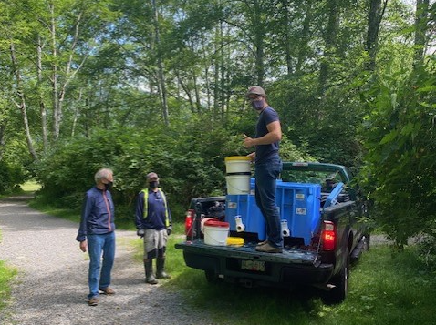 Man on a truck bed with buckets