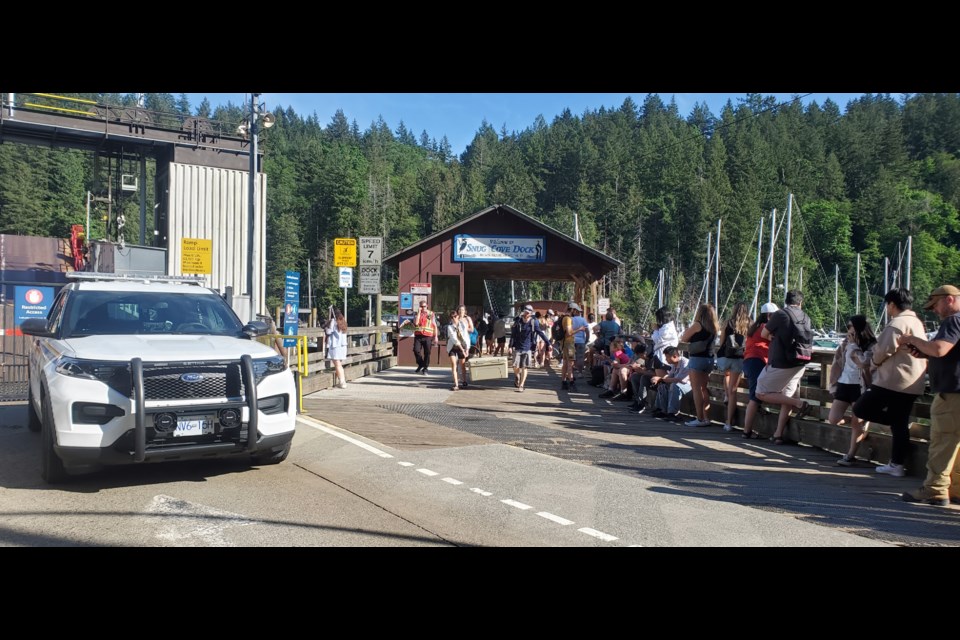 The lineup for water taxis off the island was routinely backed up well past Snug Cove Dock last Saturday.
