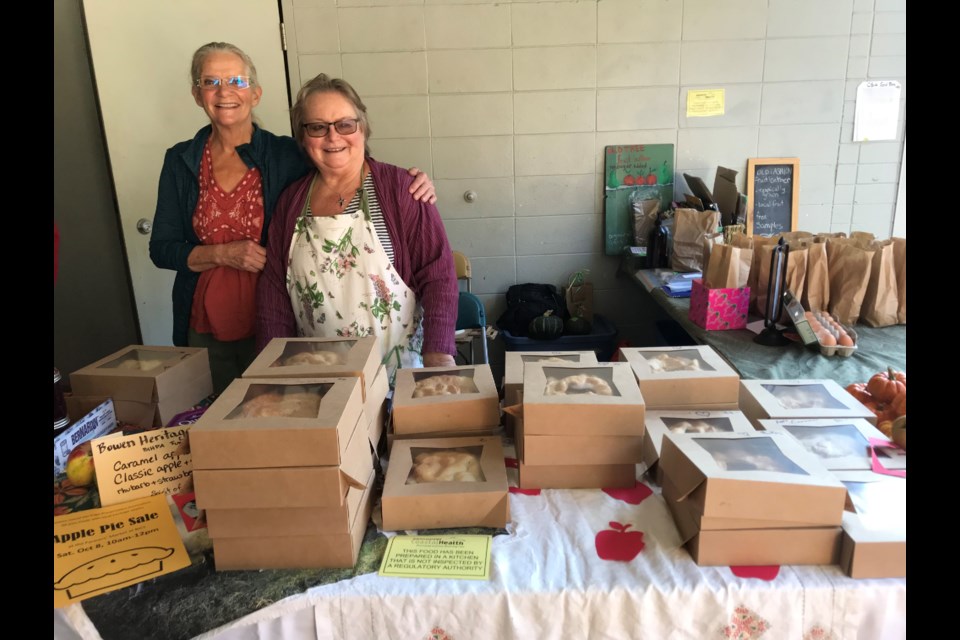 Helen Wallwork and Deb Donnelly with 59 handmade Bowen apple pies.