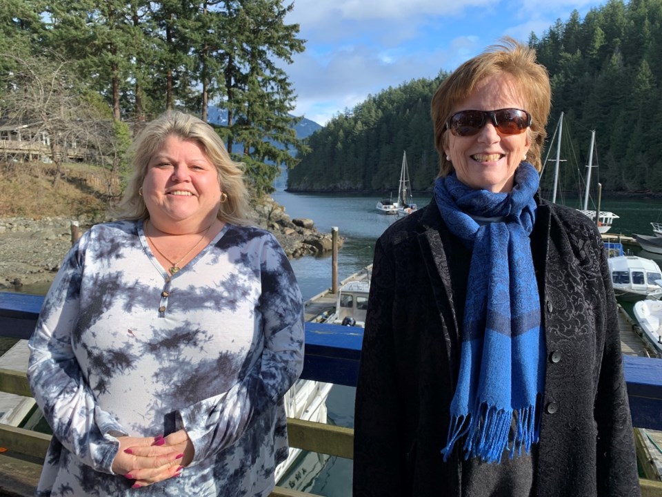 Kim Sinclair standing with Colleen O'Neil on the Bowen government dock