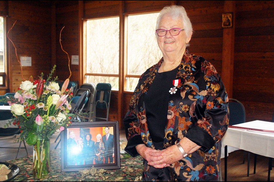 Dr. Lynn Beattie poses with her photo from November's investiture at Rideau Hall in Ottawa. She was presented the honour by former Governor General Michaëlle Jean, with her daughter, son, and grandson as guests. 