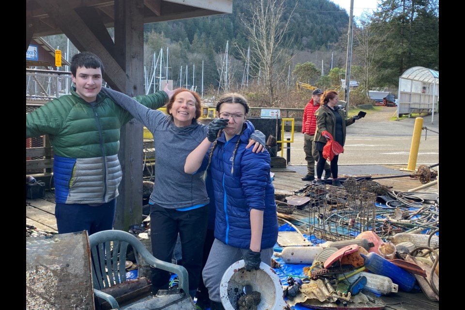 Noam Olsson, Pam Matthews, and Arabelle Richer were a few of the dozens of volunteers who took part in an underwater cleanup in the Cove on Jan. 28, 2023. 