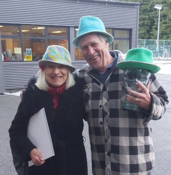 Ruben's handmade hats modelled by their new owners, Paul Hoosen and Monique Dauchot, at the CSA Christmas Craft Fair on Dec. 4. Ruben's Hats will be for sale at the Dec. 10 Winter Farmers Market & Craft Fair.