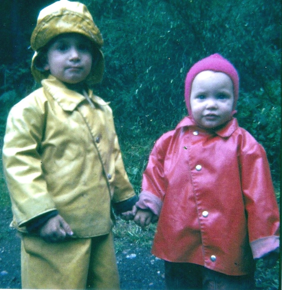 John and Mary Letson in rain gear as young children