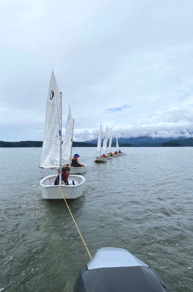 BIYC sailboats being towed