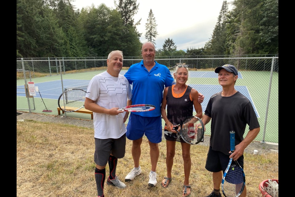 The tourney champions were (L-R) Rick Bulich, Sean Delaney, Pam Culver, and Jens Diercks.