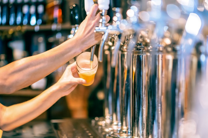 Pouring a beer from tap