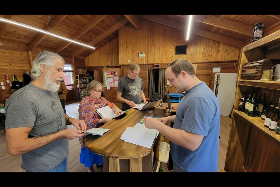 The Weir is Theatre on the Isle’s latest undertaking, with the otherworldly stories set to debut later this month. Part of the team, seen here rehearsing at Collins Hall, are (L-R) actor Thomas Newman, stage manager Helen Wallwork, and actors John Parker and Calder Stewart. 