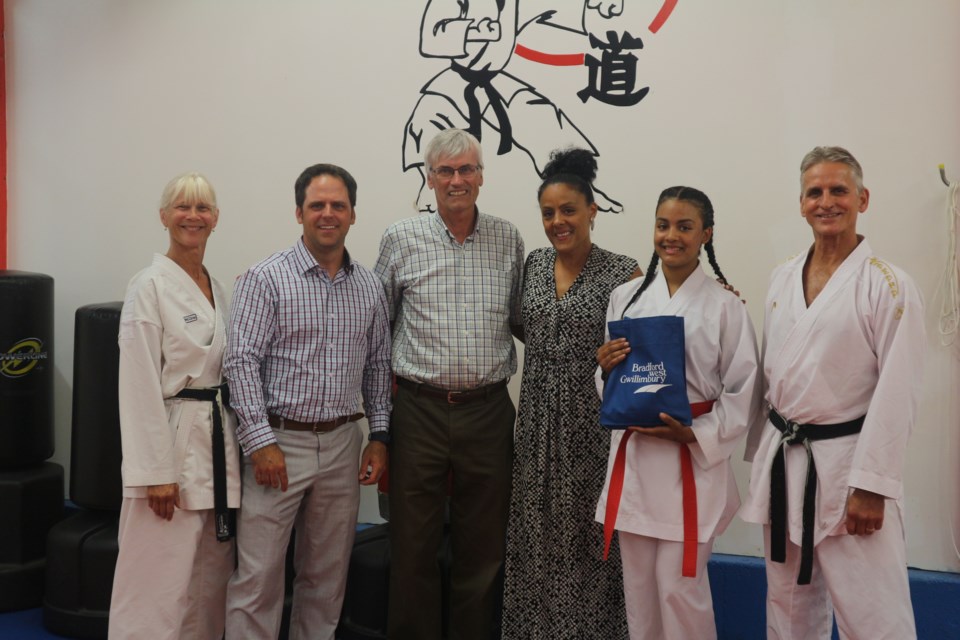 From Left to Right: Trish Jennings, Peter Ferragine, Rob Keffer, Ramona Deane, Olivia Deane and Jim Jennings at Jennings School of Karate to recognize Olivia's qualification to the Junior Pan American Games this month. Natasha Philpott/BradfordToday                              