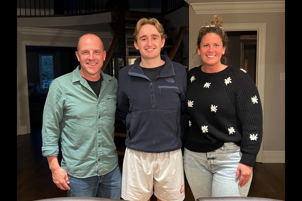 From left: Bruce McMahon, Austin Gust and Nicole Higgins reunite at the Gust family home in Newmarket on May 17, 2023, after McMahon and Higgins helped save Gust when he collapsed during the Spring Fling Marathon in De La Salle Park in Jacksonâs Point on May 6, 2023.