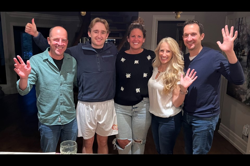Bruce McMahon (from left), Austin Gust, Nicole Higgins, Debbie Gust and Kevin Gust reunite at the Gust family home in Newmarket  after McMahon and Higgins helped save Austin when he collapsed during the Spring Fling Marathon in De La Salle Park in Jackson's Point on May 6, 2023.