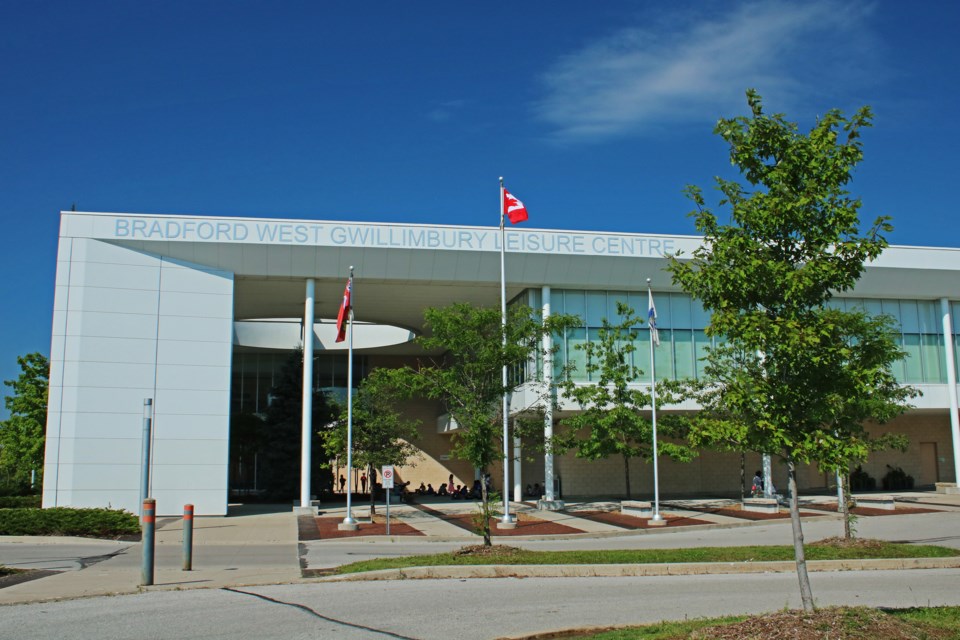 Trees can be seen around the BWG Leisure Centre and in the parking lot as a group enjoys the shade at Sunshine Meeting Place at the centre in Bradford on Thursday, Aug. 3, 2023.