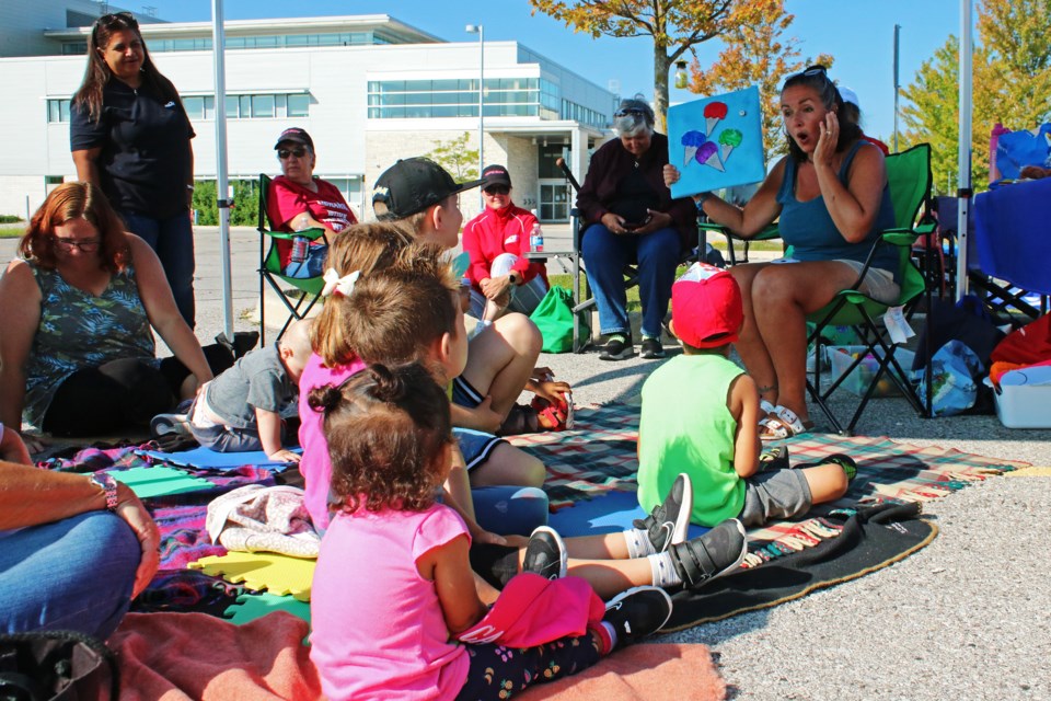 Michelle DeGasperis leads a group of children in songs and activities during storytime on the picket line at the Bradford West Gwillimbury Public Library on Tuesday Aug. 29, 2023.