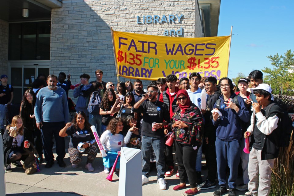 Umar Abro, Ontario Young Liberals York—Simcoe riding club president (centre with microphone), organized a protest in which dozens of Bradford District High School students joined with striking library workers and supporters on the picket line at the Bradford West Gwillimbury Public Library on Friday, Sept. 15, 2023, to call for the library’s reopening.