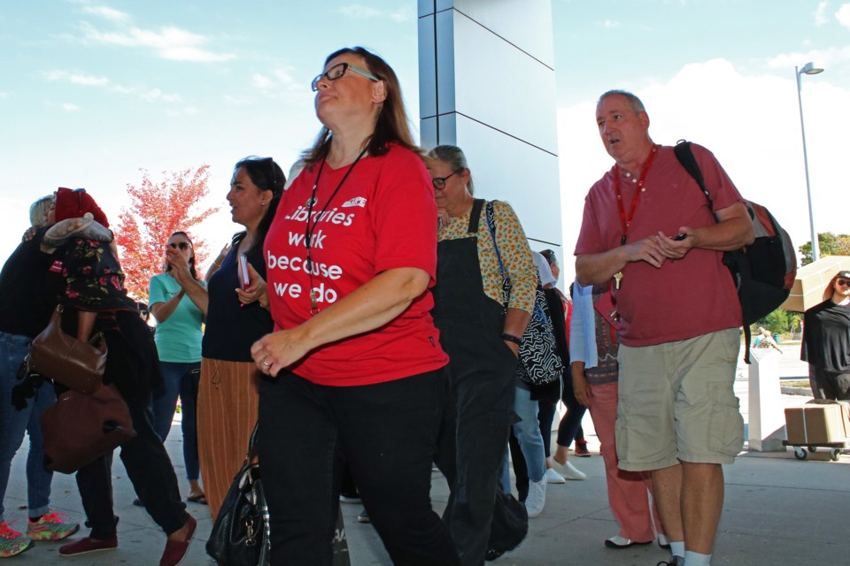 For the first time since going on strike on July 21, workers file into the Bradford West Gwillimbury Public Library on Wednesday, Oct. 4, 2023.