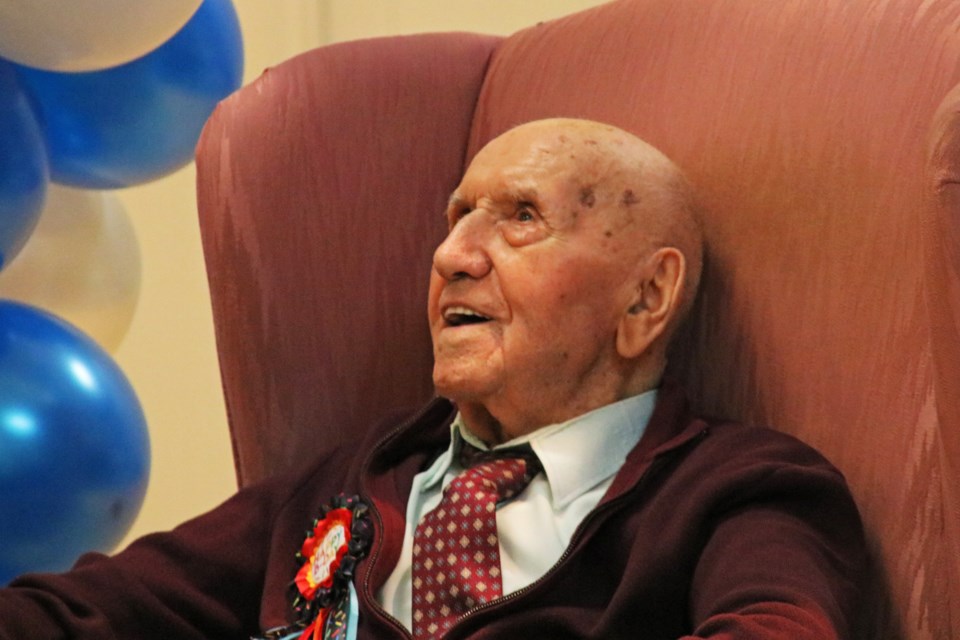 Stanley Rak smiles as he welcomes guests to his 100th birthday in the Don Harrison Auditorium of the Bradford and District Memorial Community Centre on Nov. 5.