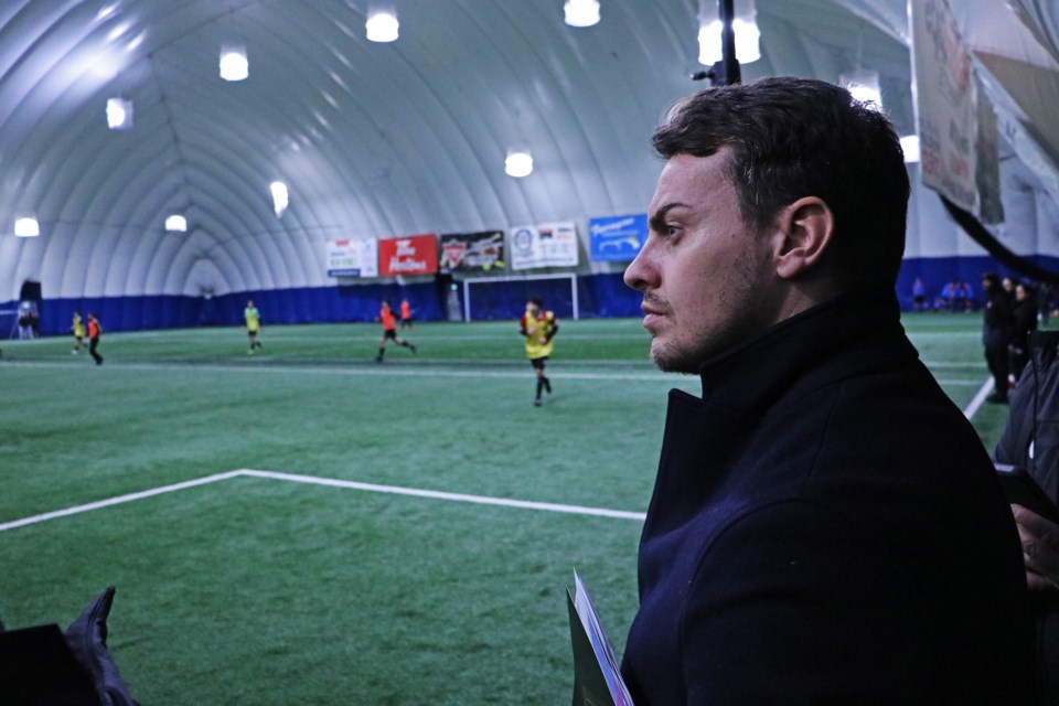 Nicolas Rognoni, FIFA agent, observes some of about 130 players from who were attracted to the trial session held at the Bradford Sports Dome by the Bradford Wolves Soccer Club.