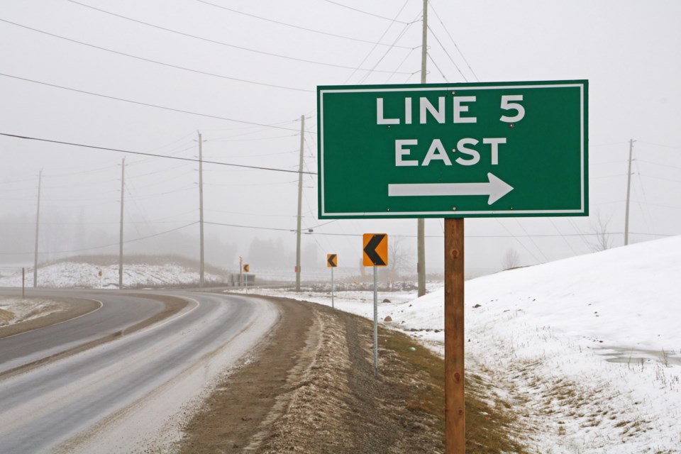 Looking northeast, a sign shows where to turn right off the SWAR to continue along Line 5 east in Bradford on Thursday, Jan. 25, 2024.
