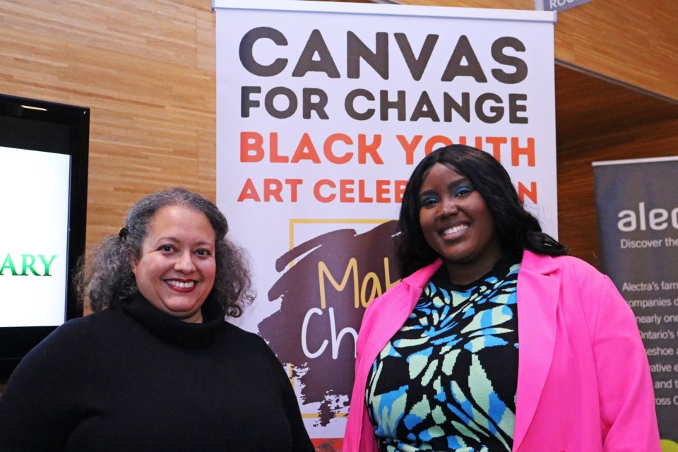 From left: Laura LaChapelle, program director for Making Change, and Ashante Blackwood, Toronto artist and mentor, are seen at the opening gala for Canvas for Change: Black Youth Art Showcase at the Bradford West Gwillimbury Public Library.