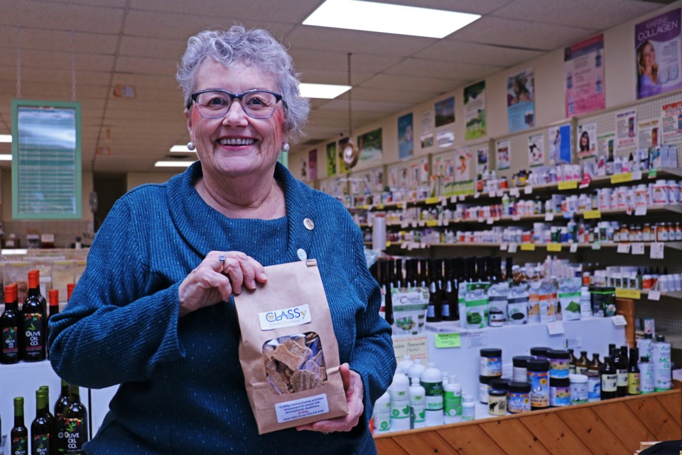 Nancy Young, owner of Nancy’s Nifty Nook, holds a bag of the CLASSy Canine Cookies in her store at 152 Holland St. E. on Feb. 1.