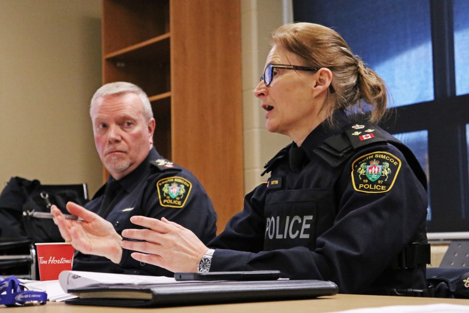 From left: South Simcoe Police Service Chief John Van Dyke listens as Deputy Chief Sheryl Sutton provides the monthly operational update for January during the police services board meeting at the South Division building in Bradford on Wednesday, Feb. 14.