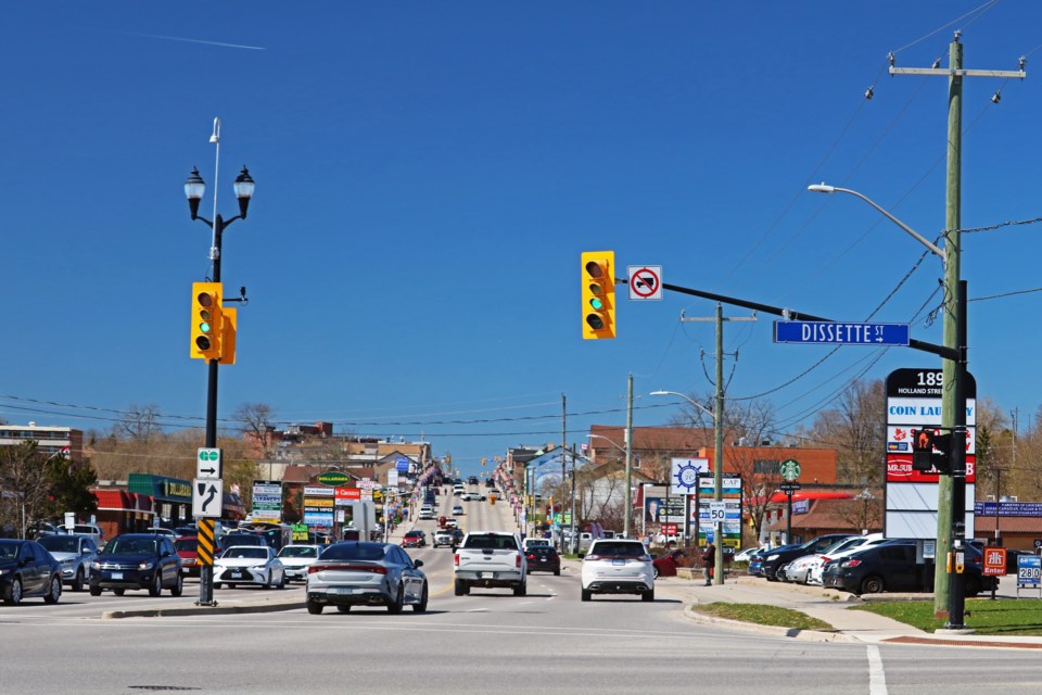 Traffic flows east and west through the intersection of Holland Street and Dissette Street in Bradford on Monday morning, April 22.