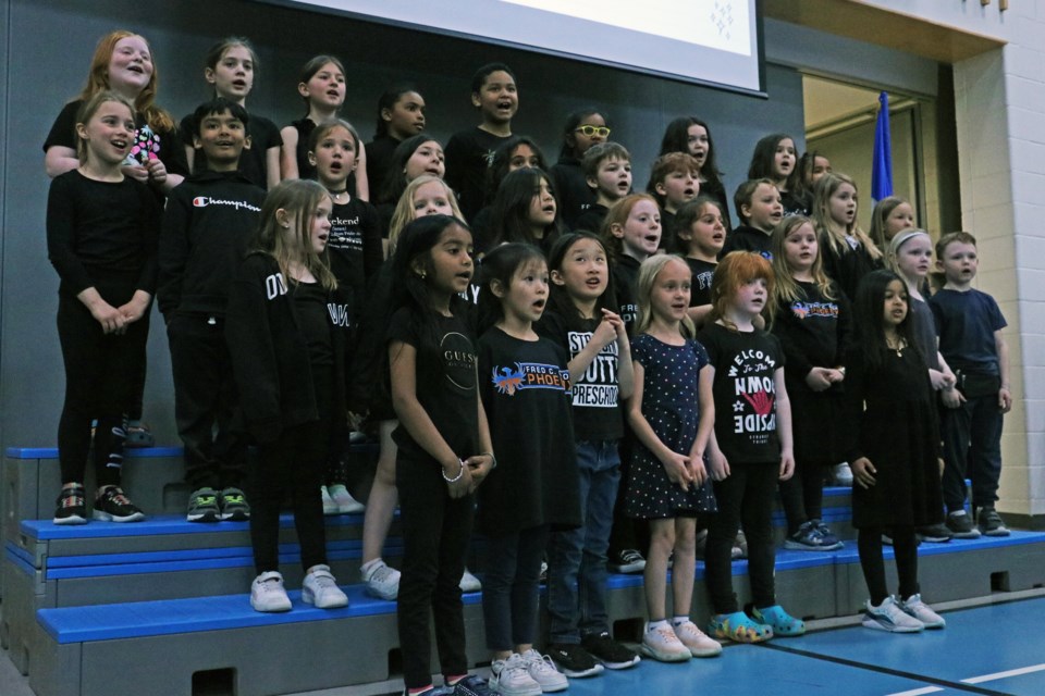 The student choir performed during the 100th anniversary celebration of Fred C. Cook Public School May 7.