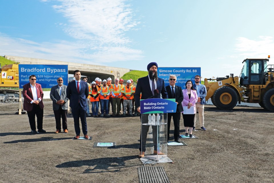 Joined by members of Bradford council and representatives from the construction industry, Minister of Transportation Prabmeet Sarkaria announced the province has awarded a $91-million contract to Dufferin Construction for the replacement of the bridge and interchange at Highway 400 and County Road 88, at a construction site near the area carpool lot in Bradford on Wednesday morning, July 17.