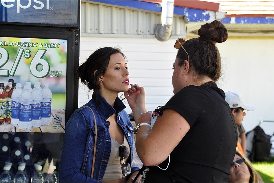 Make-up artist Laura Grace (right) with Grace-FX touches up actress Marlene Malcolm's make-up between shoots. Jackie Koazak/BradfordToday