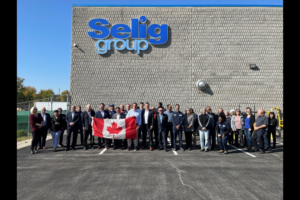 MP Scot Davidson, executives from the Selig Group, members of council, and staff from the new Selig Canada facility in Bradford West Gwillimbury celebrate the opening. 