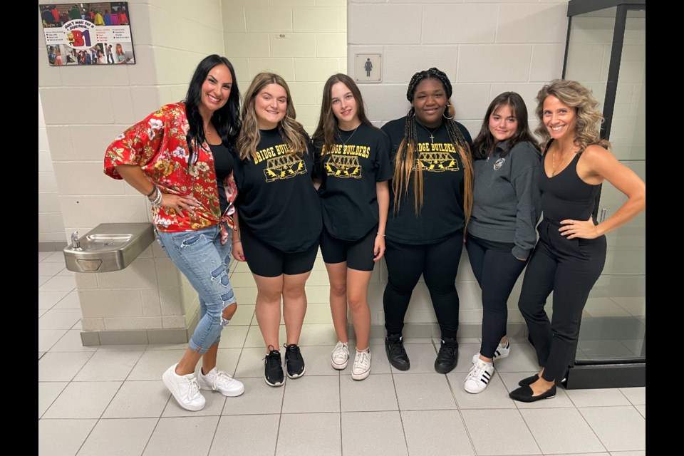 Josie Patera and Lisa Artuso, the two residents behind the #SpreadTheLoveProject, were joined by Holy Trinity Principal Heinrich Bebie and students Halyn Heartfield, Julia Pethick, Jahniyah Pryce, and Nicole Pedota for the unveiling of the girls washrooms.