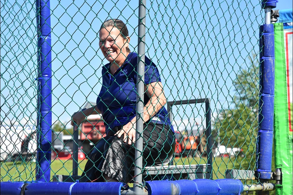 Very wet Innisfil Mayor Lynn Dollin in the dunk tank, raising money for the local food bank, and arts and culture. Miriam King/Bradford Today