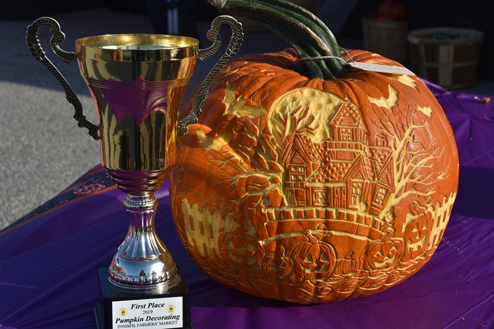 Grand champion carved pumpkin, by Tina Lund, won the trophy at the Innisfil Farmers' Market. Miriam King/Bradford Today