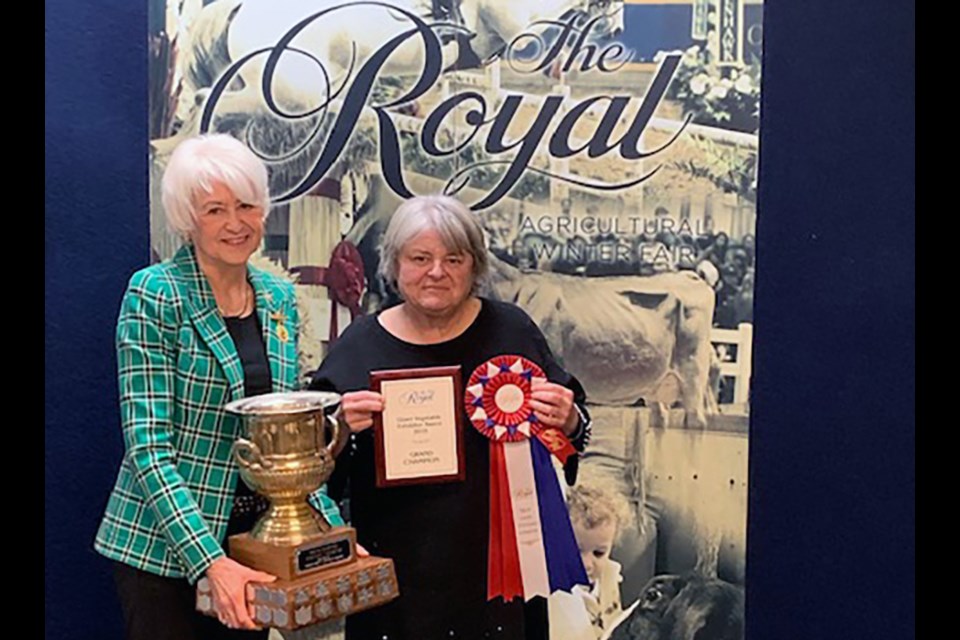 Joanne Borcsok, right, receives the 2019 Grand Champion Giant Vegetable Exhibitor trophy at the Royal Fair. SUBMITTED 