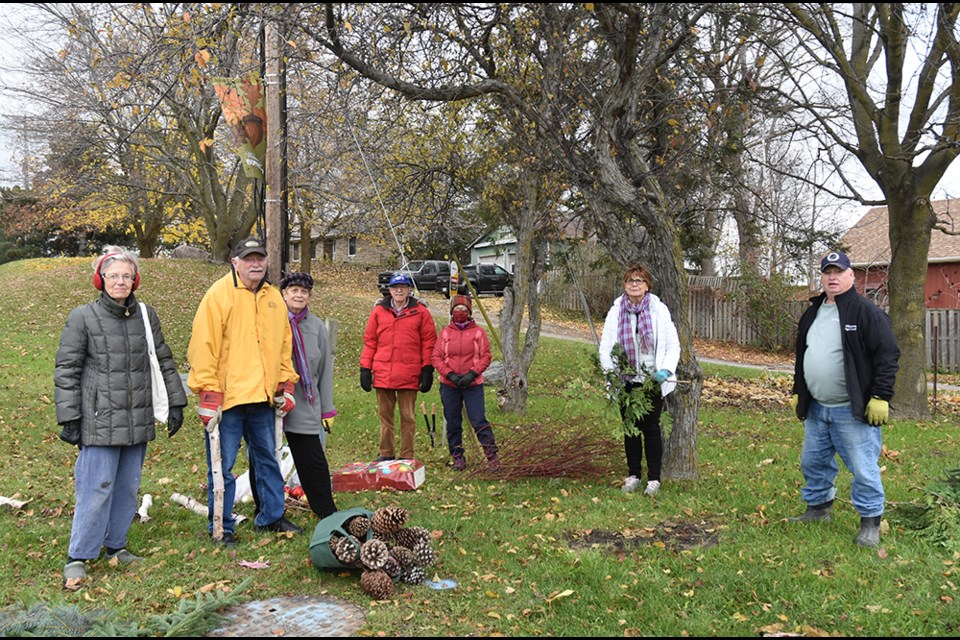 Vaccinated and practicing social distancing, members of the Bond Head-Bradford Garden Club gather at the Audrey Wychopen memorial parkette.